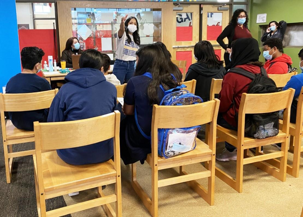 Students listen to directions during a 2023 All for Them vaccination clinic.